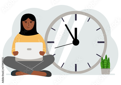 A woman sits cross-legged and holds a laptop. Next to the big clock. Time management concept, little time, much time, deadline.