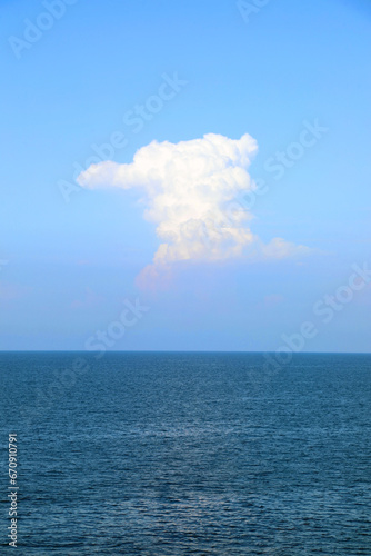 white cloud in the blue sky and under the sea without boats or ships