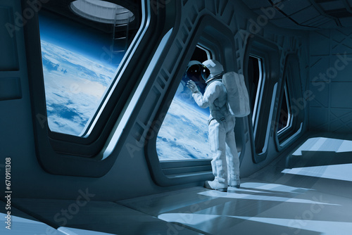 Fototapeta Naklejka Na Ścianę i Meble -  Astronaut in a Space Station looking down on Earth- Earthbound Astro
