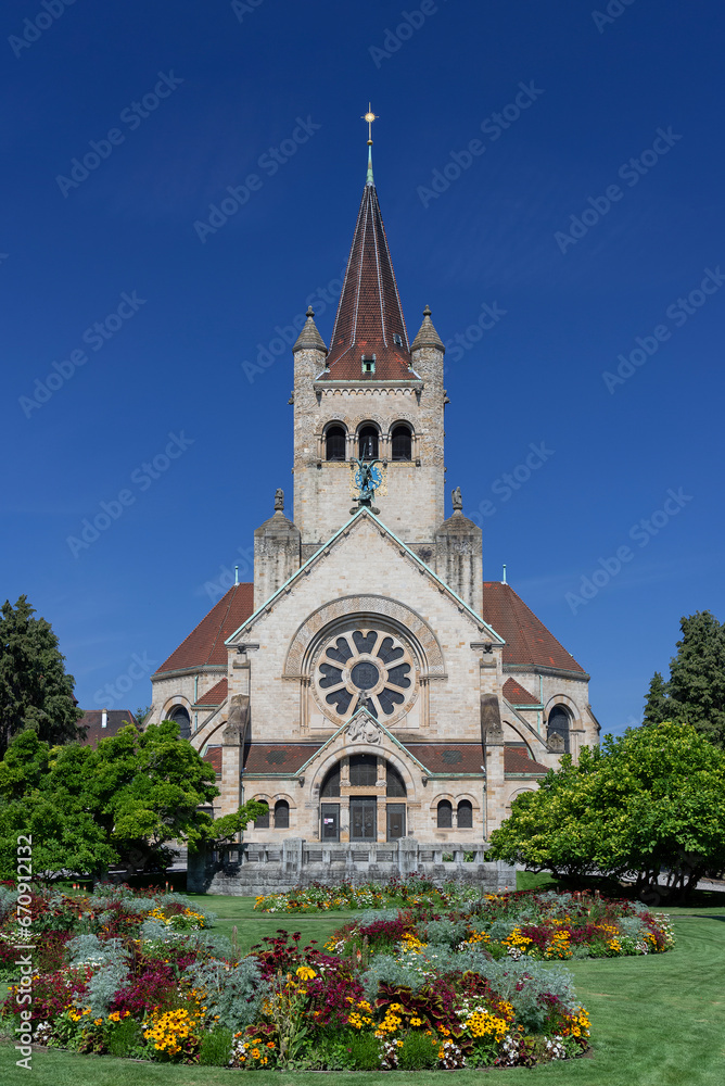Saint Paul's Church in Basel build in 1901 by Karl Moser in Art Nouveau style with a flowering garden in front