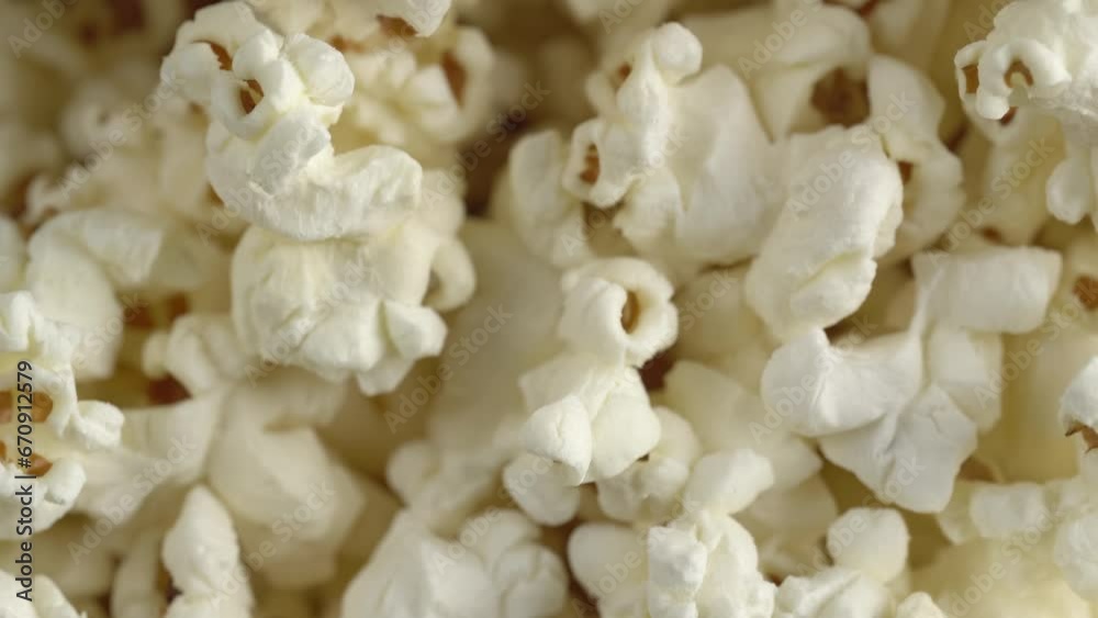 Popcorn close up. Healthy food concept. Movie food concept. Popcorn falling down Popcorn close up. Healthy food concept. Movie food concept. Popcorn falling down