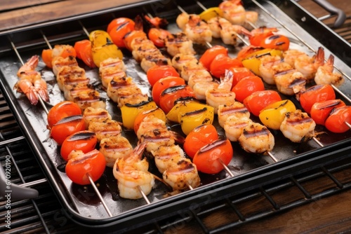 grilled shrimp skewers with grill marks on a metal tray