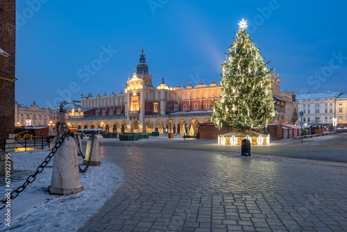 Krakow, Poland, Main Market square and Cloth Hall in the winter season, during Christmas fairs decorated with Christmas tree.