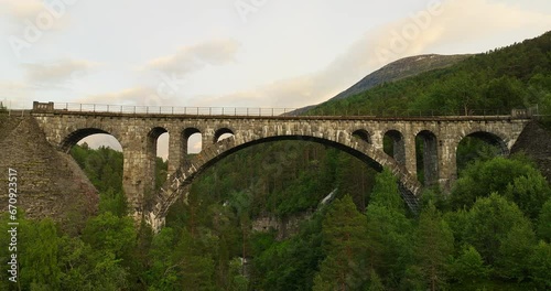 Drone pullback view from Kylling Bridge over Rauma river, Verma, Norway photo