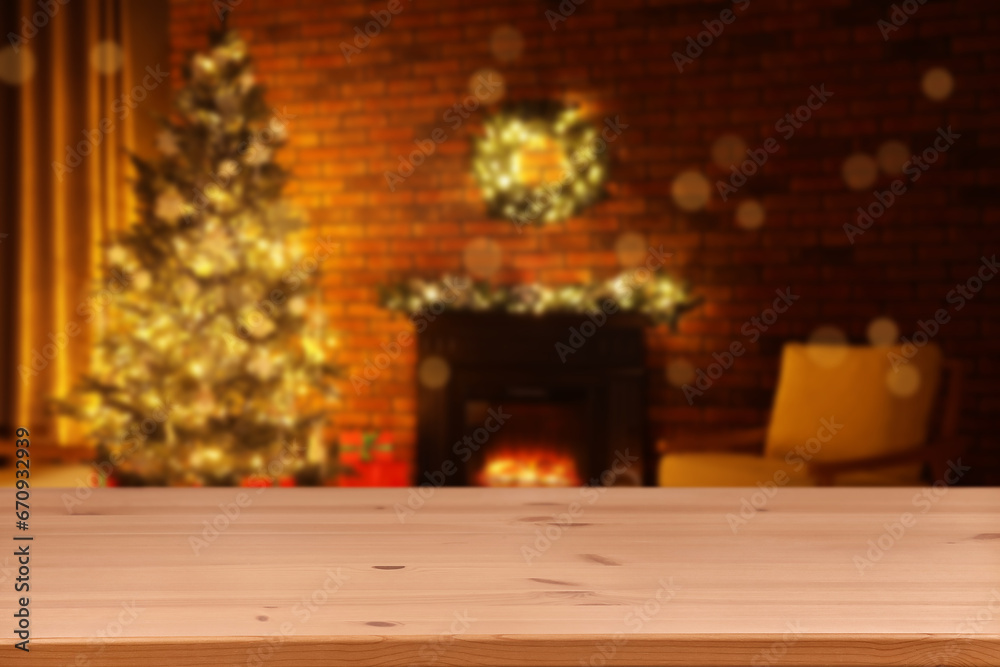 Wooden table in room decorated for Christmas. Space for design