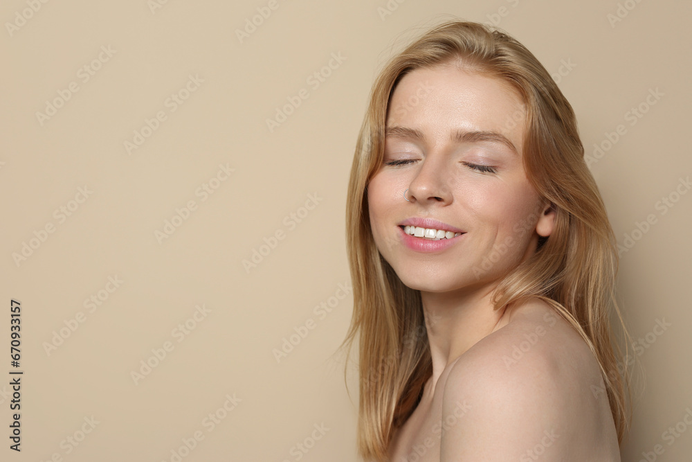 Portrait of beautiful young woman on beige background. Space for text Portrait of beautiful young woman on beige background. Space for text
