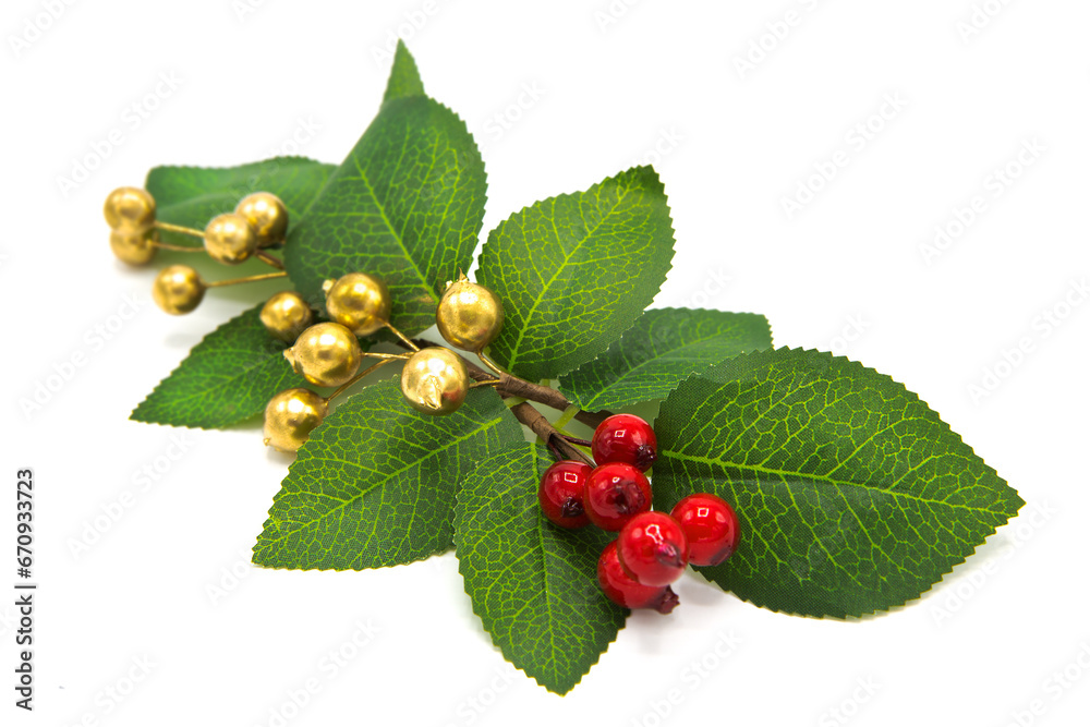 Artificial branches with berries and leaves isolated on white background. New Year and Christmas decor. Artificial branches with berries and leaves isolated on white background. New Year and Christmas decor.