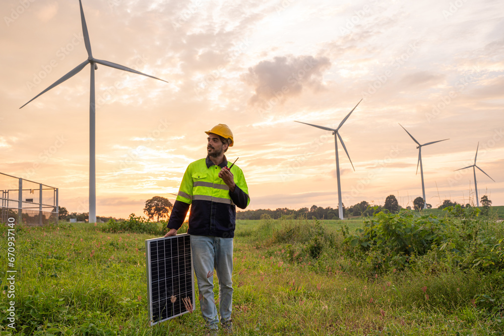 Engineer wearing uniform holding solar panels and inspection work in ...
