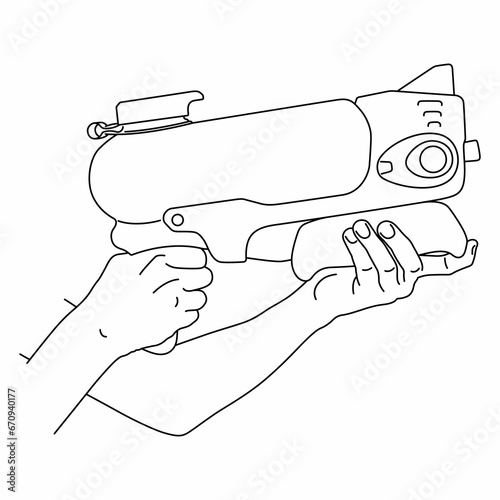 Kids hands hold toy water gun