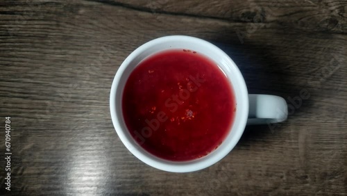 Fruit tea brewed in a mug
