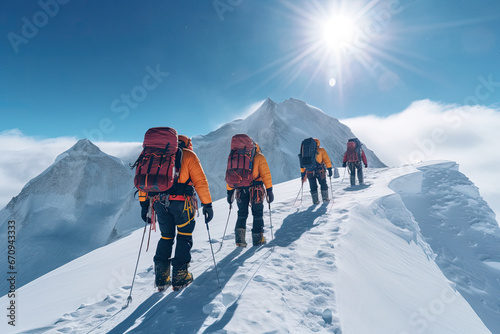Image of a group of Sherpas and mountaineers climbing Mount Everest on a sunny day. It goes with all their equipment to be able to reach the summit.