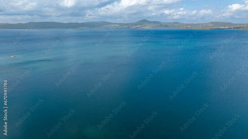 Aerial view of Lake Bracciano, originally also called Lake Sabatino. It is a lake of volcanic and tectonic origin, located in the metropolitan city of Rome and surrounded by the Sabatini Mountains.