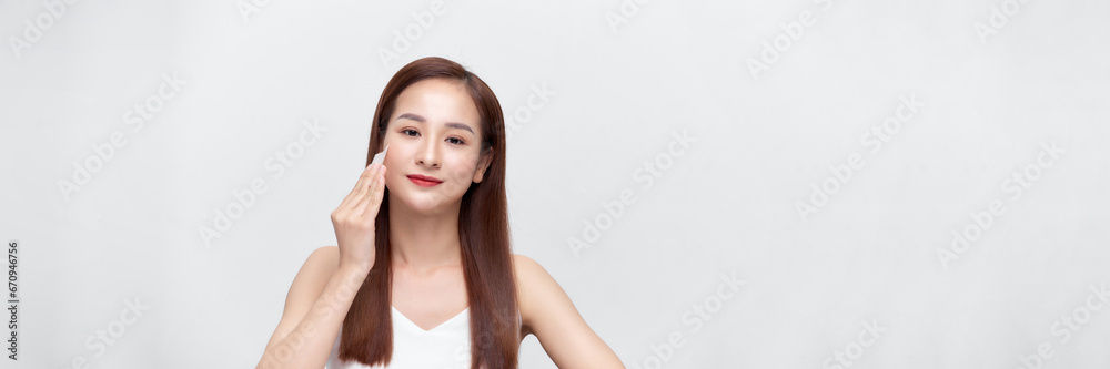 Panorama with woman removing oil from face using blotting papers. Panorama with woman removing oil from face using blotting papers.