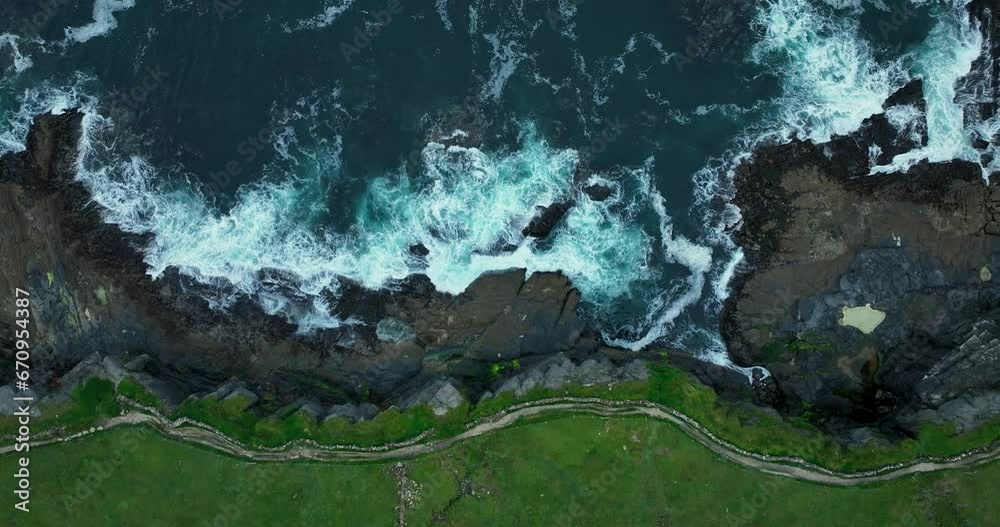 Aerial. The mighty waves of the ocean crashing against the cliffs of Moher Aerial. The mighty waves of the ocean crashing against the cliffs of Moher