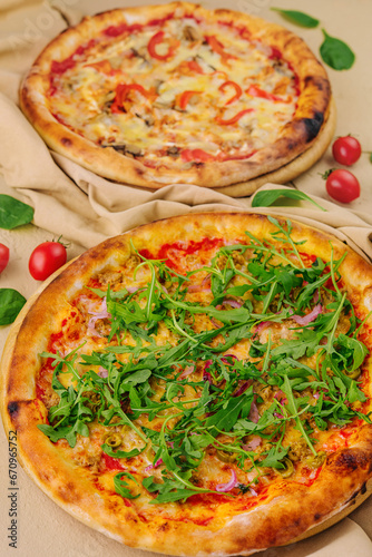 pizza with arugula and pizza with cheese and pepper
