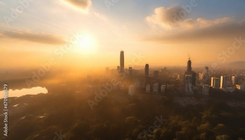 City skyline during sunset. Forest around a city. Atmospheric aerial view.