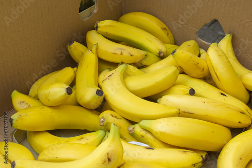 Boxes of yellow ripe bananas at market