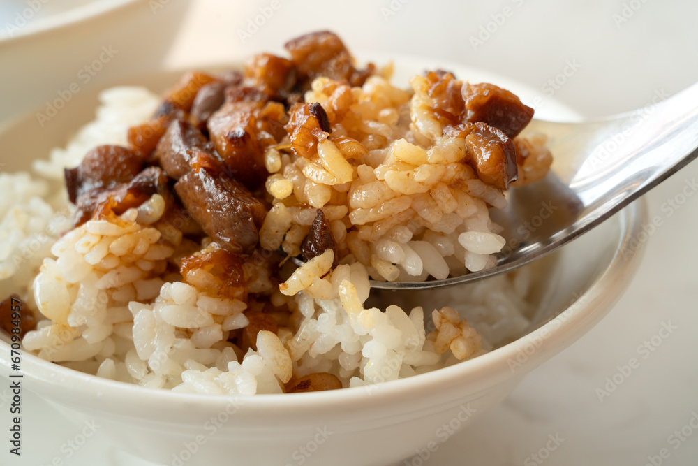 Braised meat over cooked rice, famous and delicious street food in Taiwanese restaurant. Braised meat over cooked rice, famous and delicious street food in Taiwanese restaurant.