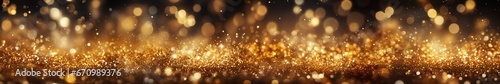 Abstract image of festive gold glitter as a background. The image can be used as a background for a banner, for greeting cards for the New Year or other holidays. © Yevheniia