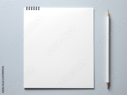 Top-down view of white paper and a pencil offers a glimpse into the essentials of an office desk. Ideal for a variety of business, creativity, and office-related concepts, this clean and uncluttered.