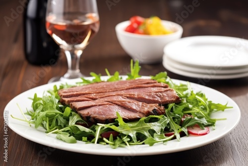 grilled duck on a bed of arugula salad