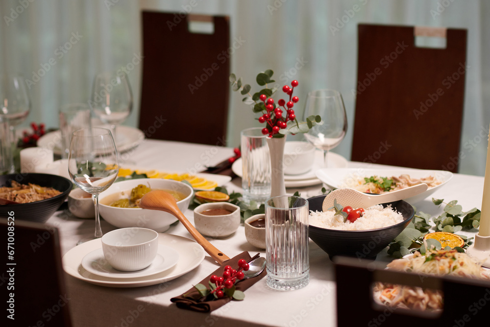 Table with various appetizers and dishes on dinner table