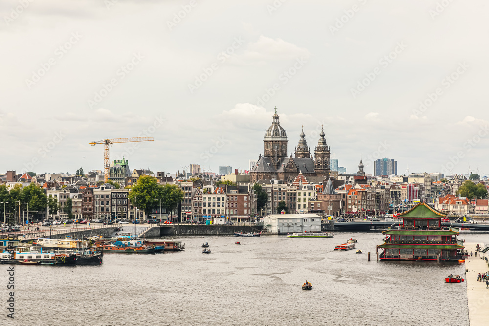 modern Amsterdam city center, canals and bridges.