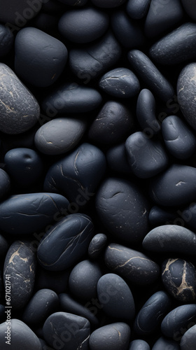 Photorealistic seamless pattern of black pebbles.