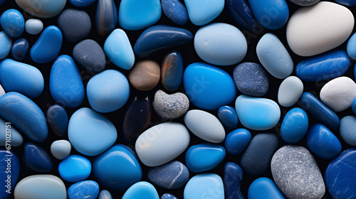 Photorealistic seamless pattern of blue pebbles.