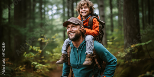 Outdoor Adventures: Father Carries Son During Forest Hike