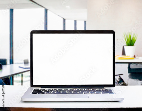 laptop computer with blank screen on table