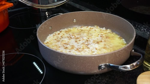 Wallpaper Mural stirring the cooked rice. Mixing the rice with a wooden spoon. stirring the rice in the pot. stirring the food on the stove. Torontodigital.ca