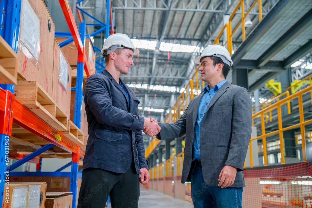 Professional business man or engineer shake hands for success of the project in factory industrial workplace or train factory. Professional business man or engineer shake hands for success of the project in factory industrial workplace or train factory.