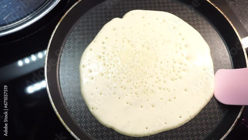Preparing pancakes in a pan. cooking pancakes. cooking for breakfast. Making pancakes for breakfast.
