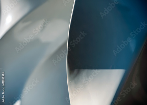 blue and gray abstract background from curved lines of geometric shapes