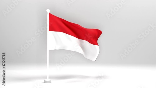 An Indonesia flag flutters against a black background from a stream of vert. Beautiful Indonesia flag on a white flagpole.