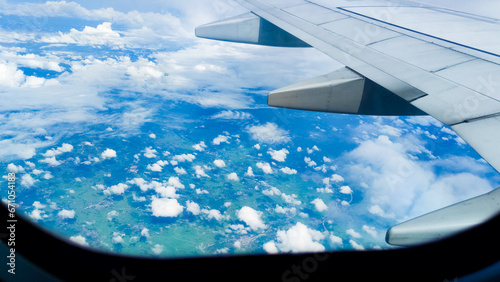 Aerial view of a scenic cloudscape with a blue sky from an airplane
