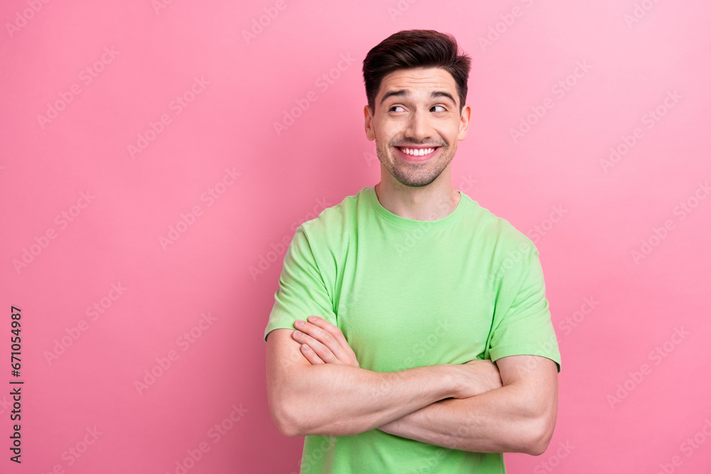 Portrait of good mood model guy folded arms looks empty space confident deciding new business plans isolated on pink color background Portrait of good mood model guy folded arms looks empty space confident deciding new business plans isolated on pink color background