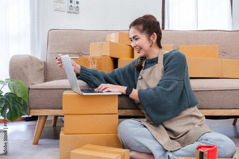 Startup small business entrepreneur SME, asian woman packing cloth in box. Portrait young Asian small business owner home office, online sell marketing delivery, SME e-commerce telemarketing concept Startup small business entrepreneur SME, asian woman packing cloth in box. Portrait young Asian small business owner home office, online sell marketing delivery, SME e-commerce telemarketing concept