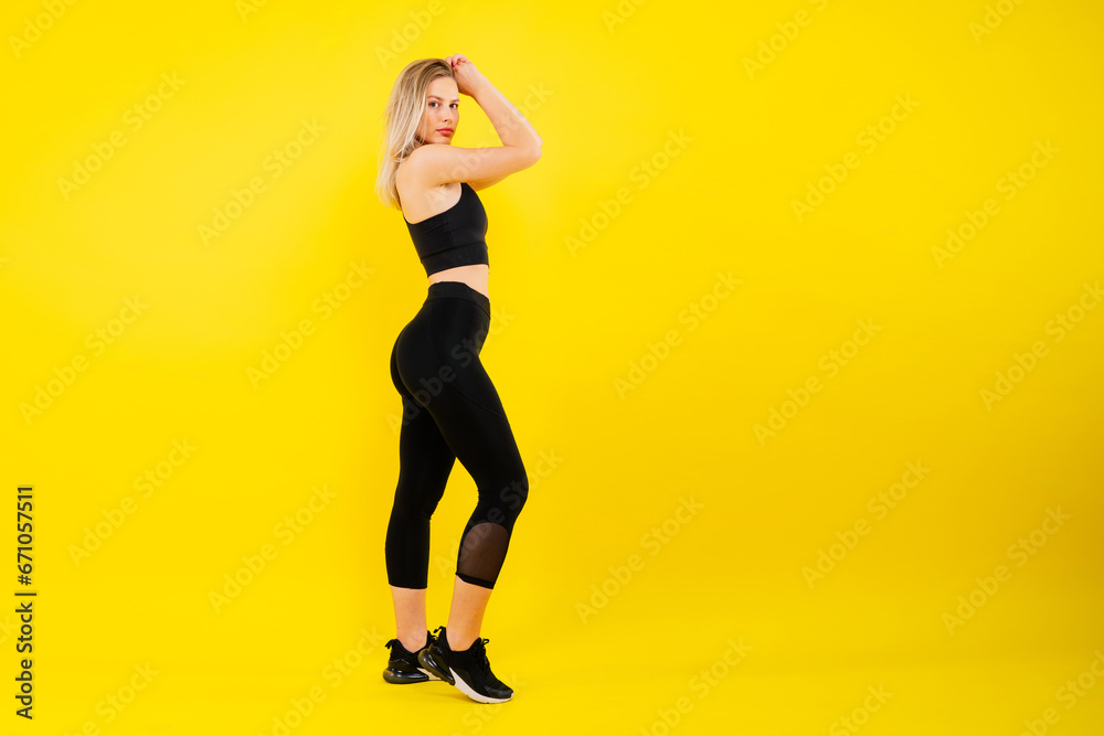 Young woman, posing in the studio. Advertising sportswear and yoga wear. Healthy lifestyle, sport