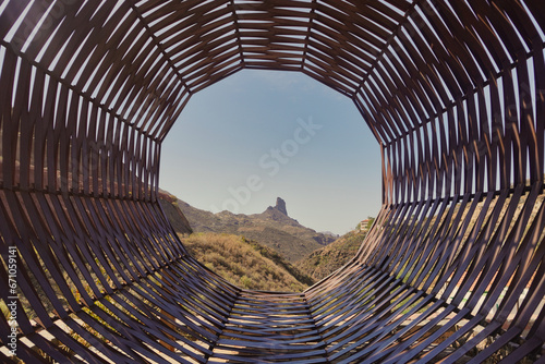 The Basket Viewpoint. Here there is a large wicker basket, a monument in tribute to those who died in strong storms in 1946. Through the basket, you can see the Roque Bentayga. photo