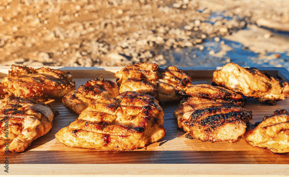 Sun-Kissed Grilled Chicken Cuts on Wooden Presentation. An Artful Display of Culinary Brilliance