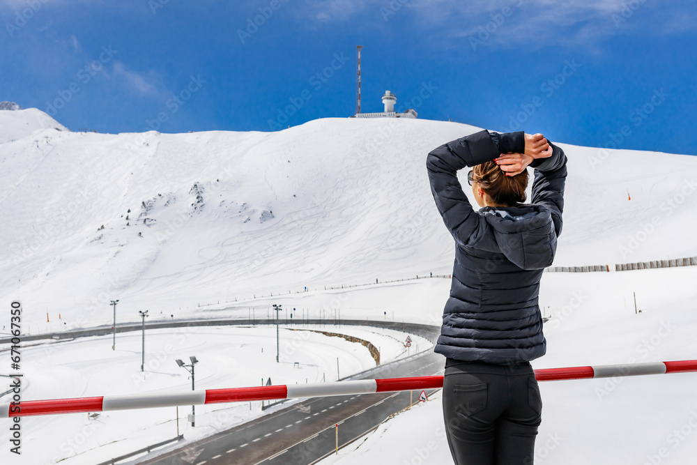 Tourist woman in Andorra. Winter snow landscape mountain of ski resort