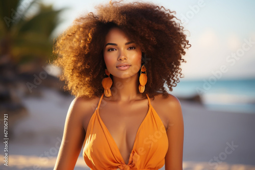 Afro-american woman model wearing an orange sundress in a garden