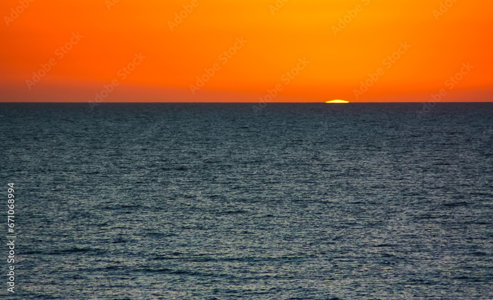  The sun has nearly gone into the Gulf of Mexico, Florida.