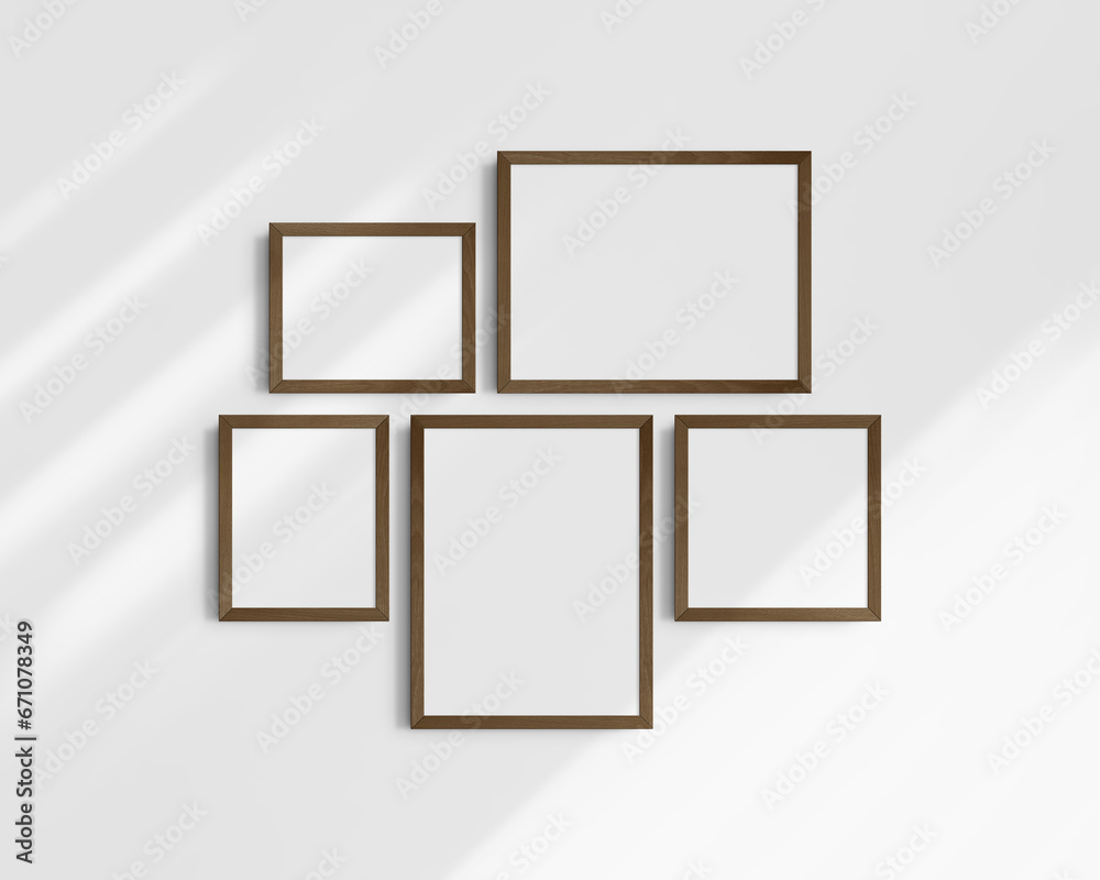 Gallery wall mockup set, 5 dark brown frames. Modern frame mockup. Horizontal, vertical, square frames, 12x16 (3:4), 16x12 (4:3), 8x10 (4:5), 10x8 (5:4), 10x10 (1:1) inches. White wall with shadows. Gallery wall mockup set, 5 dark brown frames. Modern frame mockup. Horizontal, vertical, square frames, 12x16 (3:4), 16x12 (4:3), 8x10 (4:5), 10x8 (5:4), 10x10 (1:1) inches. White wall with shadows.