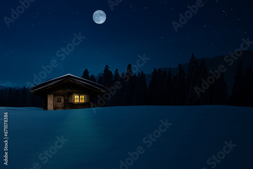 Schihütte mit beleuchtetem Fenster in einer kalten Winternacht