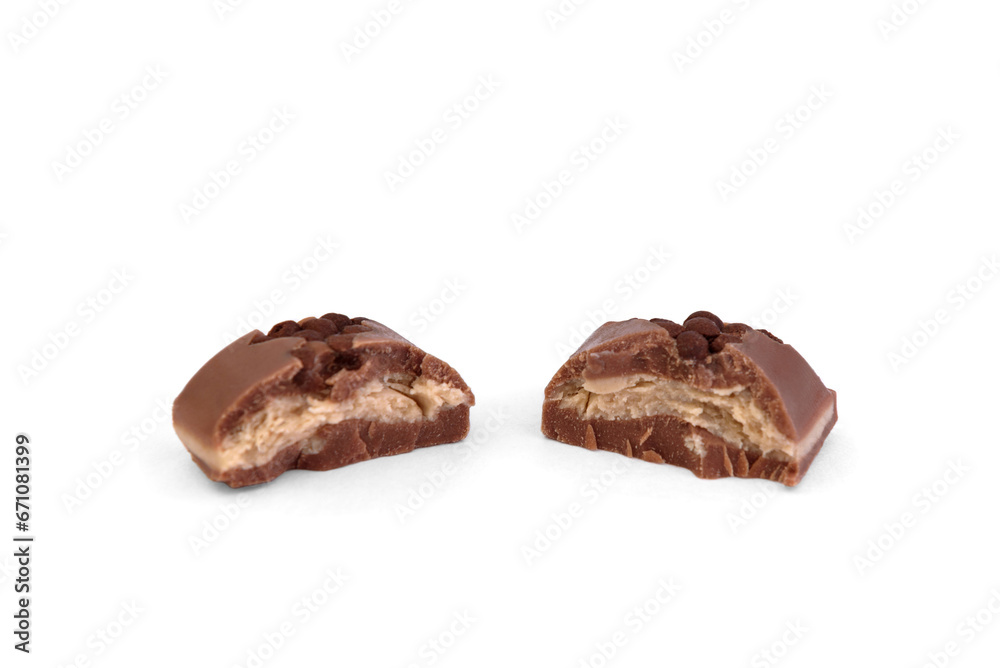 Broken piece of milk chocolate with hazelnut filling isolated on white background. Broken piece of milk chocolate with hazelnut filling isolated on white background.