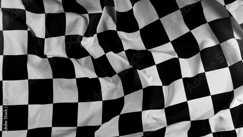 Checkered Race Flag. Freeze Motion Wavy closeup fabric fluttering Racing Flags background. Formula One flag car motor sport. © Lukas Gojda