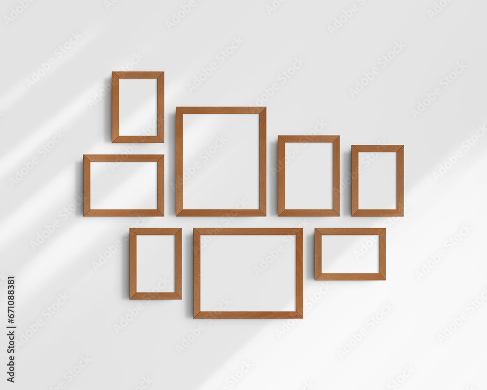 Gallery wall mockup set, 8 cherry wood frames. Modern frame mockup. Horizontal, vertical frames, 4x6 (2:3), 6x4 (3:2), 5x7 (5:7), 7x5 (7:5), 8x10 (4:5), 10x8 (5:4) inches. White wall with shadows. Gallery wall mockup set, 8 cherry wood frames. Modern frame mockup. Horizontal, vertical frames, 4x6 (2:3), 6x4 (3:2), 5x7 (5:7), 7x5 (7:5), 8x10 (4:5), 10x8 (5:4) inches. White wall with shadows.